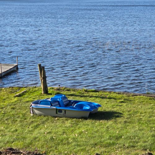 EXTERIOR:  The private peddle boat that is included with the rental