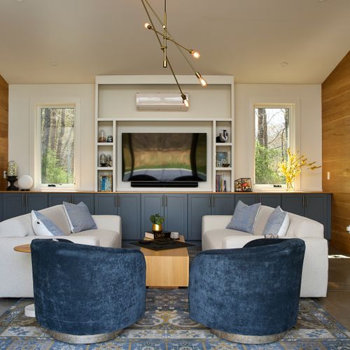 The pool house was designed for relaxed indoor-outdoor living, with huge sliding glass doors that open directly onto the pool deck.