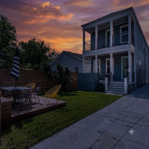 Spacious backyard w/ covered porch & plenty of seating to gather & unwind.