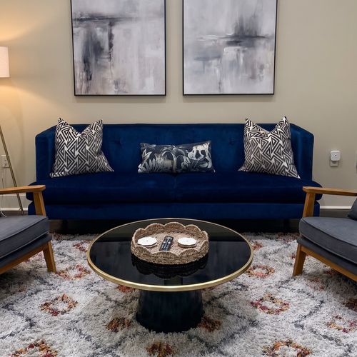 Tastefully decorated lounge with a statement blue sofa