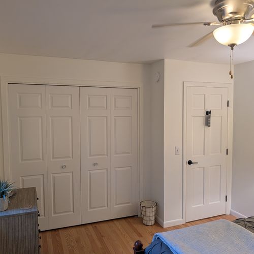 BEDROOM #2 (SECOND FLOOR):  Features a queen-size bed, nightstands, lamps, ceiling fan, dresser, mirror, and closet.