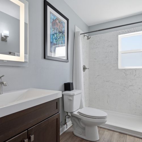 Fresh, clean bathroom w/ all the essentials to refresh & recharge.