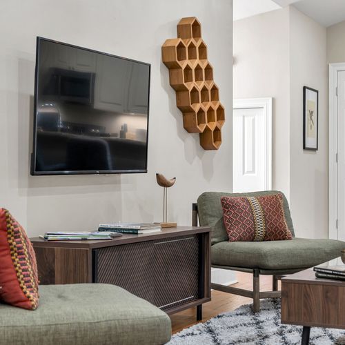 Smart TV beside a honeycomb wine rack