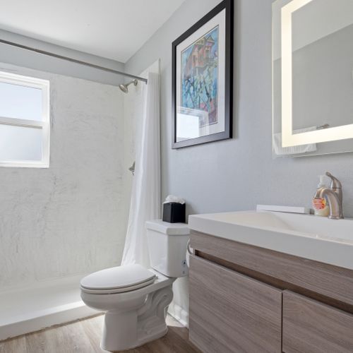 Fresh, clean bathroom stocked w/ essentials to refresh & recharge.