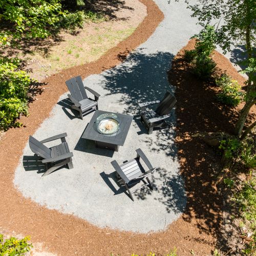 Relax under the trees around the private fire pit, perfect for evenings with family and friends