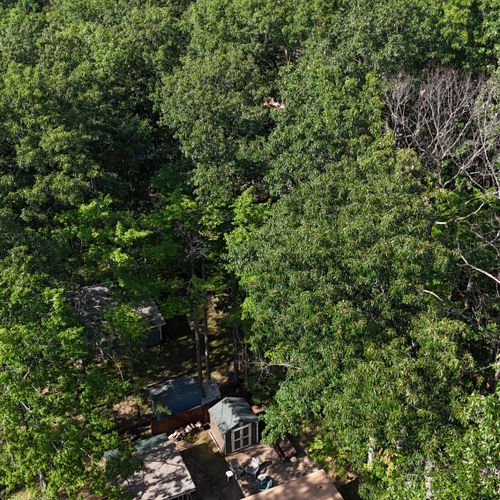OVERVIEW:  Aerial photo from above the cabin looking out over Higgins Lake.