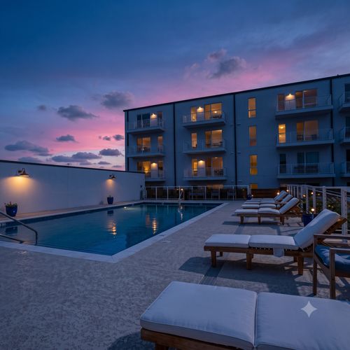 Resort-style pool w/ lounge chairs — perfect for a lazy afternoon soak.