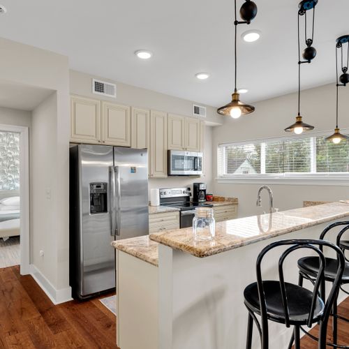 Sunlit kitchen with views out the window