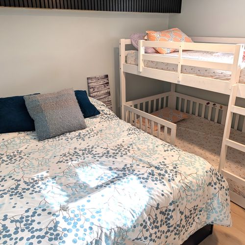 BEDROOM #3 (LOWER LEVEL):  Features a full-size bed, bunk bed, and a foosball table.