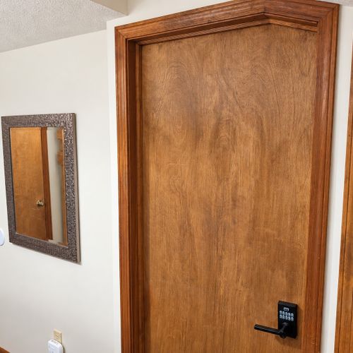 BEDROOM #2 (FIRST FLOOR):  Features a twin-on-twin bunk bed, nightstand, closet, dresser, and mirror.