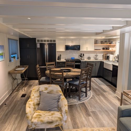 DINING AREA (FIRST FLOOR):  The home has a convenient dining area between the kitchen and living room with a dining table and seating for up to 6 adults.