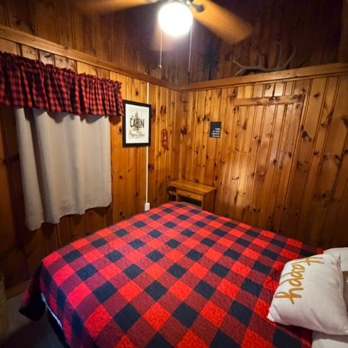 BEDROOM #2:  Features a queen-size bed, dresser, and a nightstand.