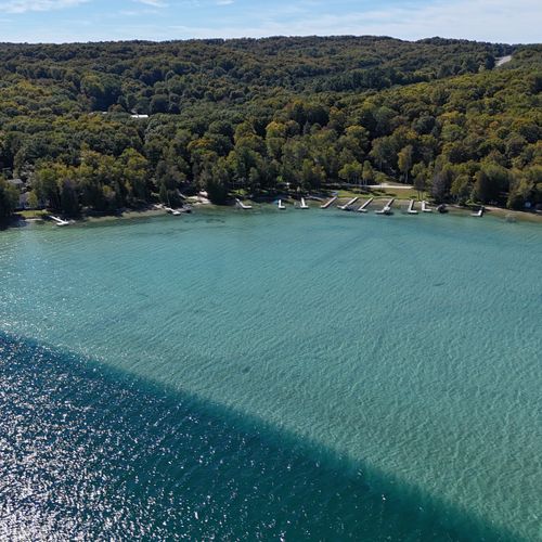 EXTERIOR:  Aerial photo looking back at the property from up above Crystal Lake.