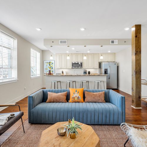 Stylish open living with exposed beams and modern flair