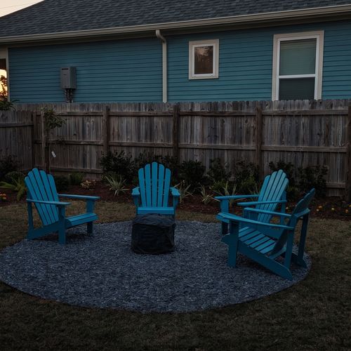 Vibrant outdoor seating w/ Adirondack chairs on a blue rug — made for lazy afternoons.
