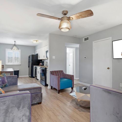 Spacious open-plan living & dining area filled w/ natural light.