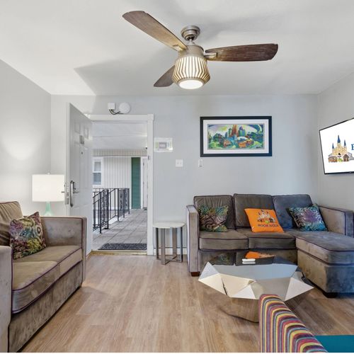 Unit 303 – Inviting living room w/ smart TV & plenty of seating to gather.