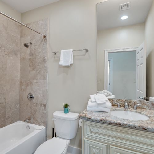 Fresh towels and a glass shower waiting for you