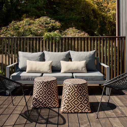 Loungers on the main house deck, accessed through the oversized sliding doors.