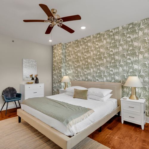 Ceiling fan and palm walls for a tropical retreat