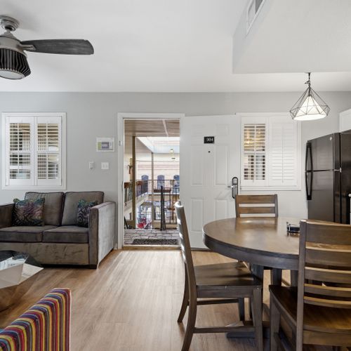 Living room w/ open entryway — bright, airy & easy to settle into.