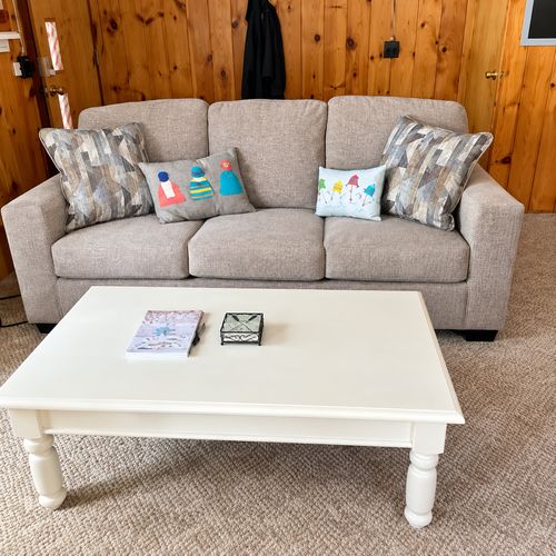 OVERVIEW:  The home has a comfy and relaxing living room with a sofa, chair coffee table, and television.  (Note that the wood fireplace in the living room is not available for guest usage.)