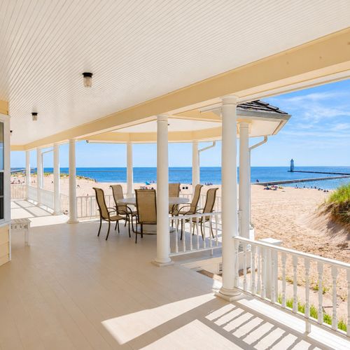 EXTERIOR:  Another view of the back porch, which has spectacular views of Lake Michigan and the Frankfort Lighthouse