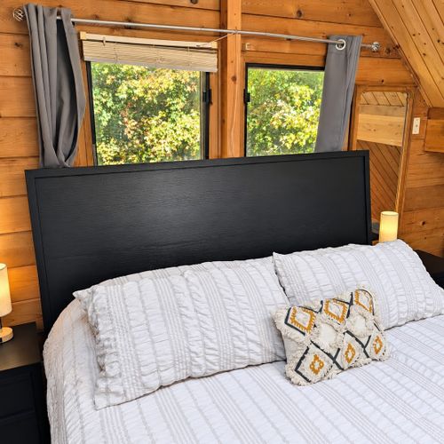 LOFT (THIRD FLOOR):  The home has a very cute top floor loft area with a king size bed, fold-out bed, chairs, nightstands, lamps, mirror, dresser, clothing rack, and a television.