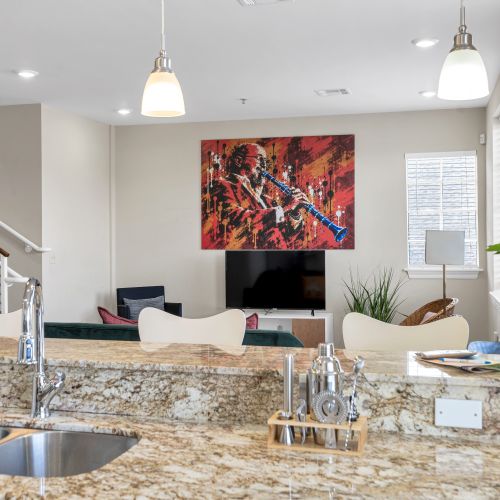 Living room view framed by bold red artwork