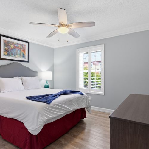 Soft, neutral queen bedroom designed for a peaceful night's sleep.