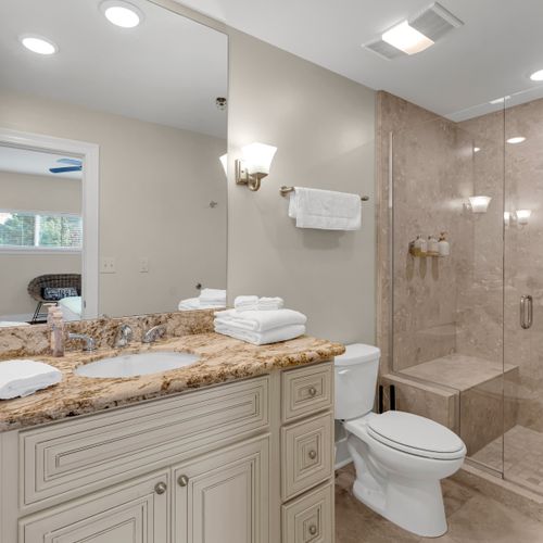 Spa-inspired bath with sconce lighting