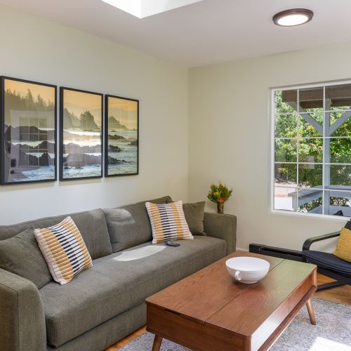Comfortable lounge space with natural light and peaceful garden views.
