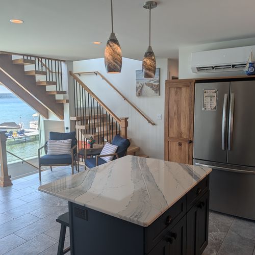 KITCHEN (SECOND FLOOR):  The home has a full kitchen with a kitchen island and all appliances, including a dishwasher.  There is also a great view of Crystal Lake from the ktichen!