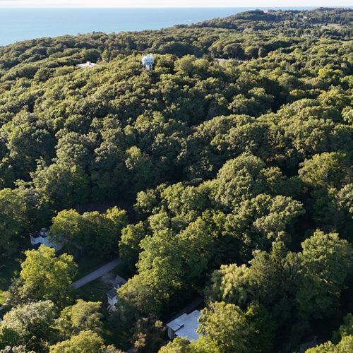 OVERVIEW:  Aerial photo from above the property showing Tower Hill behind the property along with Lake Michigan to the west.