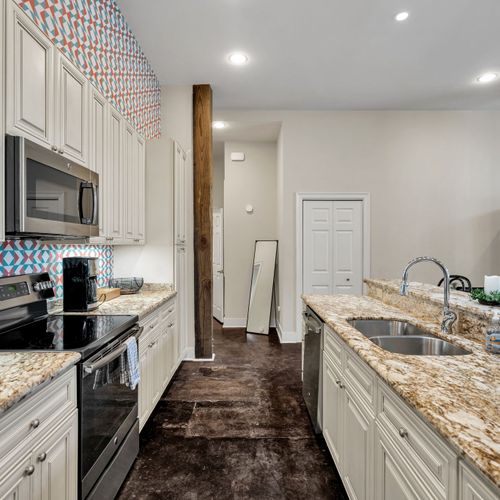 Galley kitchen with exposed wood beam