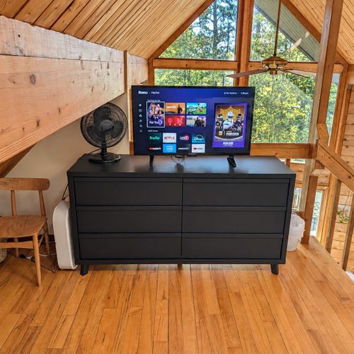 LOFT (THIRD FLOOR):  The home has a very cute top floor loft area with a king size bed, fold-out bed, chairs, nightstands, lamps, mirror, dresser, clothing rack, and a television.