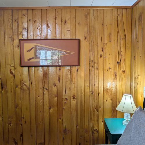 BEDROOM #1:  Includes a queen-size bed, nightstands, lamps, a dresser, and a mirror.