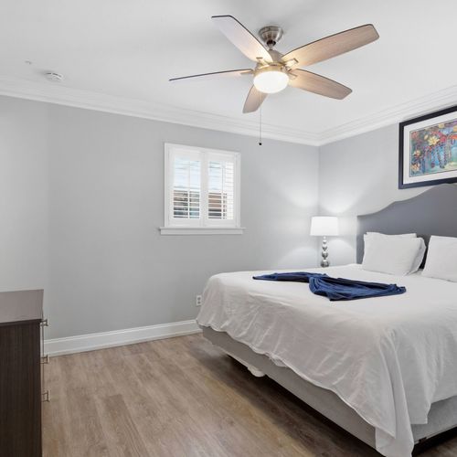Unit 206 king bedroom w/ elegant, clean styling & a restful ambiance.