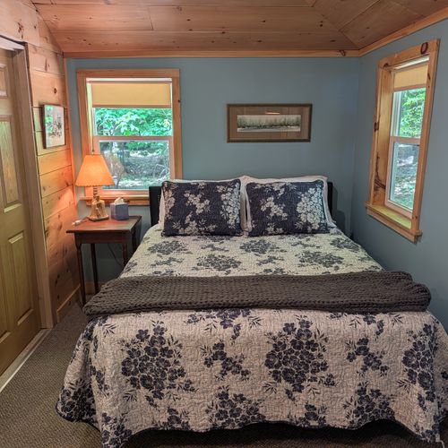 LIVING ROOM: The comfy, cozy queen bed adjoined to the living room