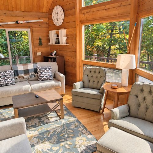 LIVING ROOM (SECOND FLOOR):  The home has a gorgeous living room with a sofa, loveseat, chairs, coffee table, and large screen television.