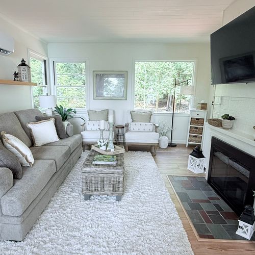 LIVING ROOM:  Very comfy living room featuring a sofa bed, large screen television, and a mini-split A/C unit.  (The fireplace is not usable, but does have battery-operated candles in it for ambiance.)