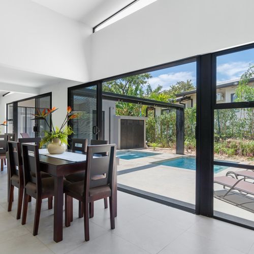 Dining area that looks out into the pool