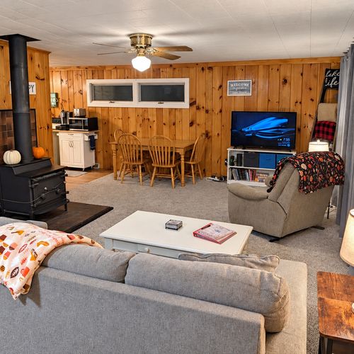 OVERVIEW:  The home has a comfy and relaxing living room with a sofa, chair coffee table, and television.  (Note that the wood fireplace in the living room is not available for guest usage.)
