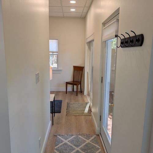 LIVING SPACE: The main entrance of the cute and cozy apartment facing towards where the comfy full-size bed is located