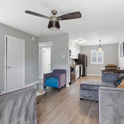 Open-concept living area w/ Smart TV & stylish furnishings for relaxed evenings in.