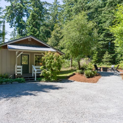 Nestled among the trees, this cozy cottage offers a peaceful escape with private outdoor seating