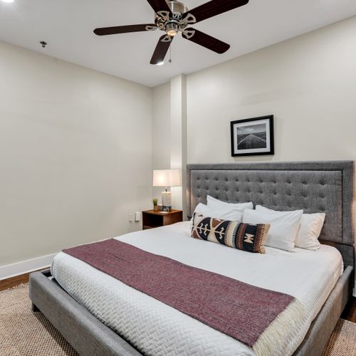Boutique-style bedroom with framed art