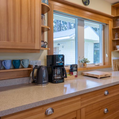 Start your morning with the coffee maker or electric kettle, then prepare meals with the cutting boards, cookware, utensils, and spacious countertops—all thoughtfully stocked for everyday cooking.