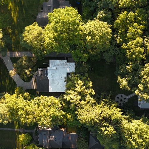 EXTERIOR:  Aerial photo of the house.  (Deer Run, a separate vacation rental property, shares the same driveway and is shown at the right of the photo.)