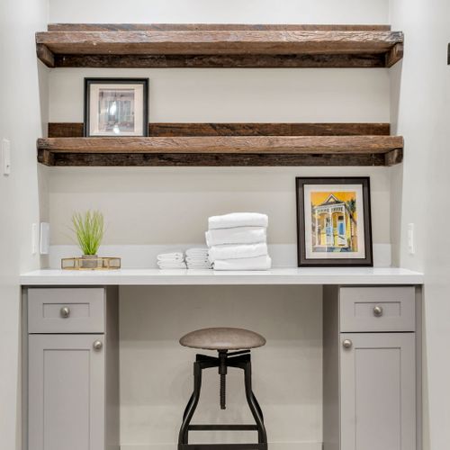 Work desk with a floating reclaimed shelf